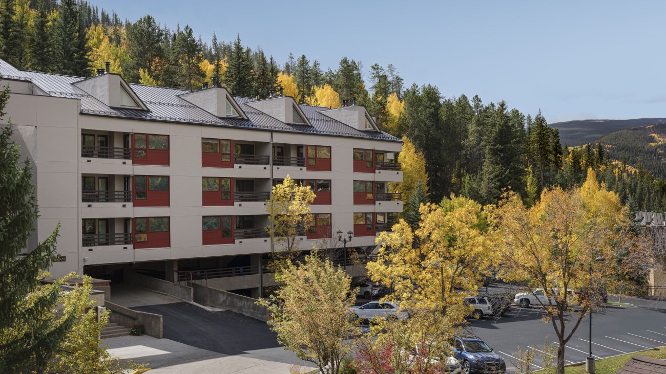 Exterior of Marriott's StreamSide Douglas resort timeshare with forested mountains in distance